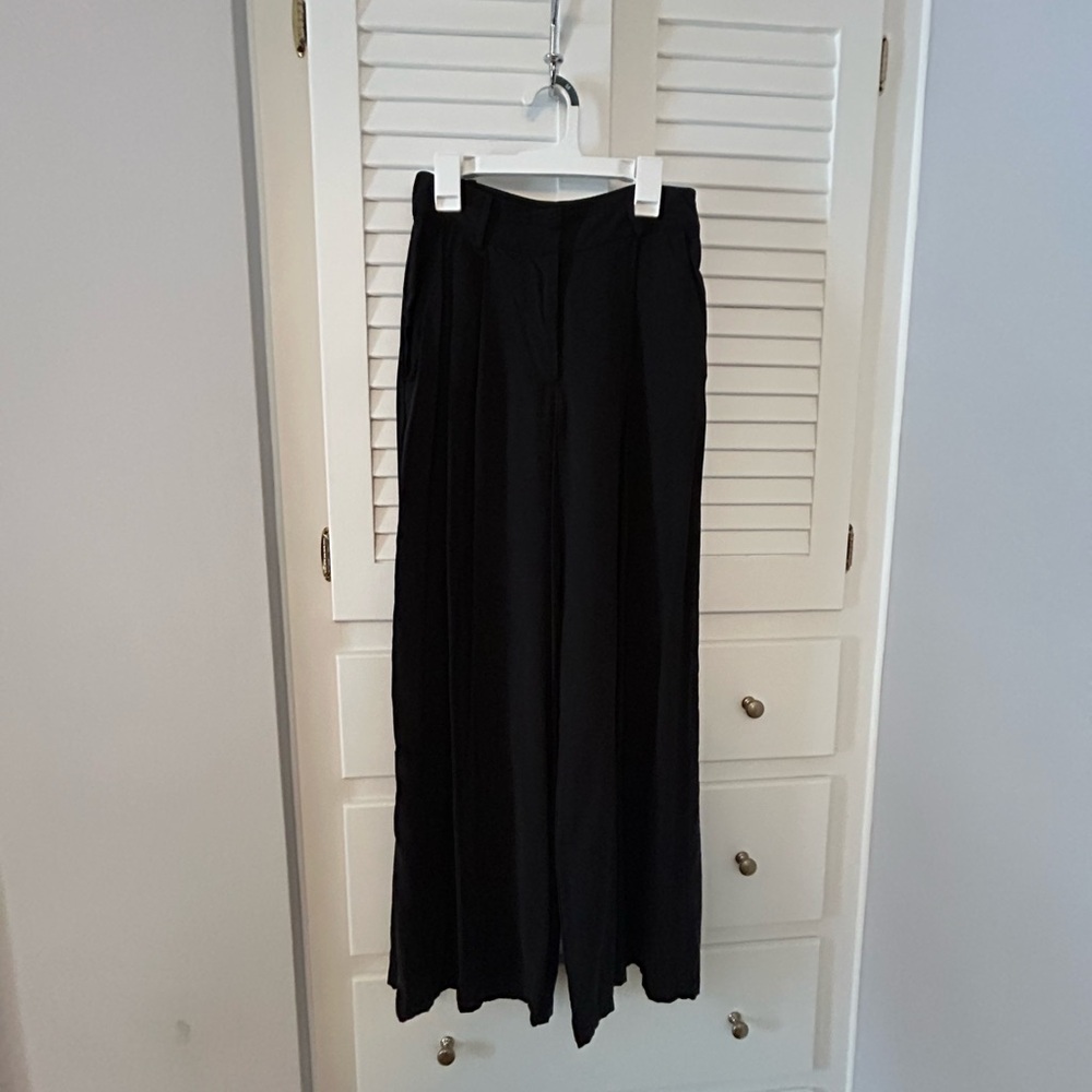 Black billowy cargo like pants, flare at the bottom